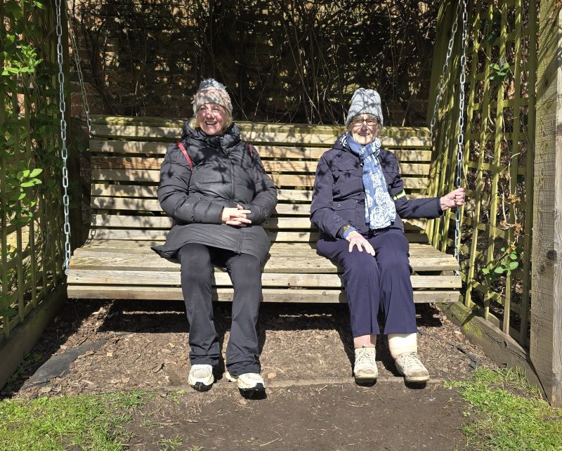 Jo and Margaret enjoying a rest on the swinging seat.